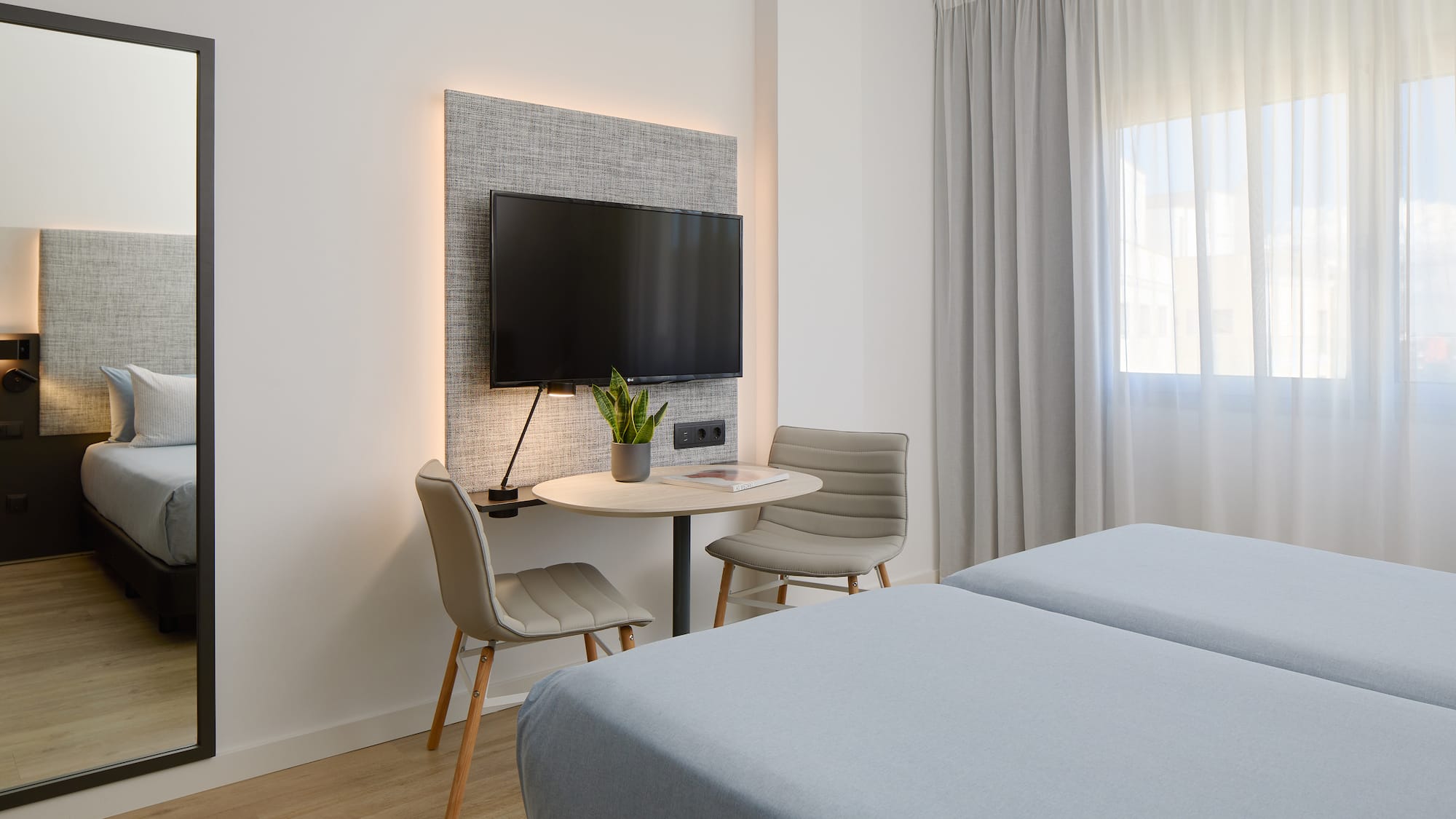 a room with a tv and a table