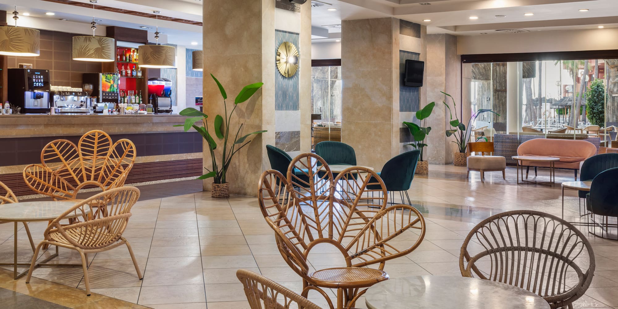 Modern hotel lounge bar with unique rattan chairs and stylish decor.