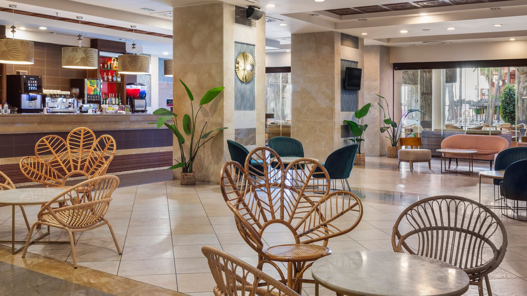 Modern hotel lounge bar with unique rattan chairs and stylish decor.