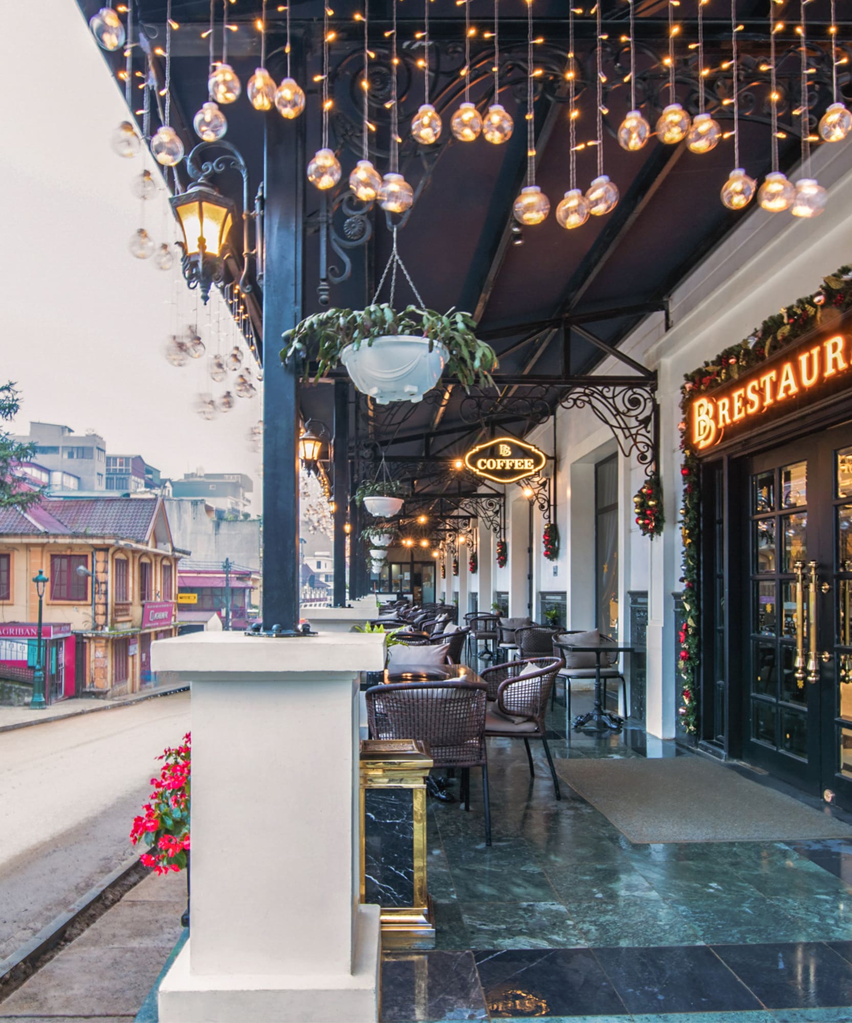 a restaurant with lights from the ceiling