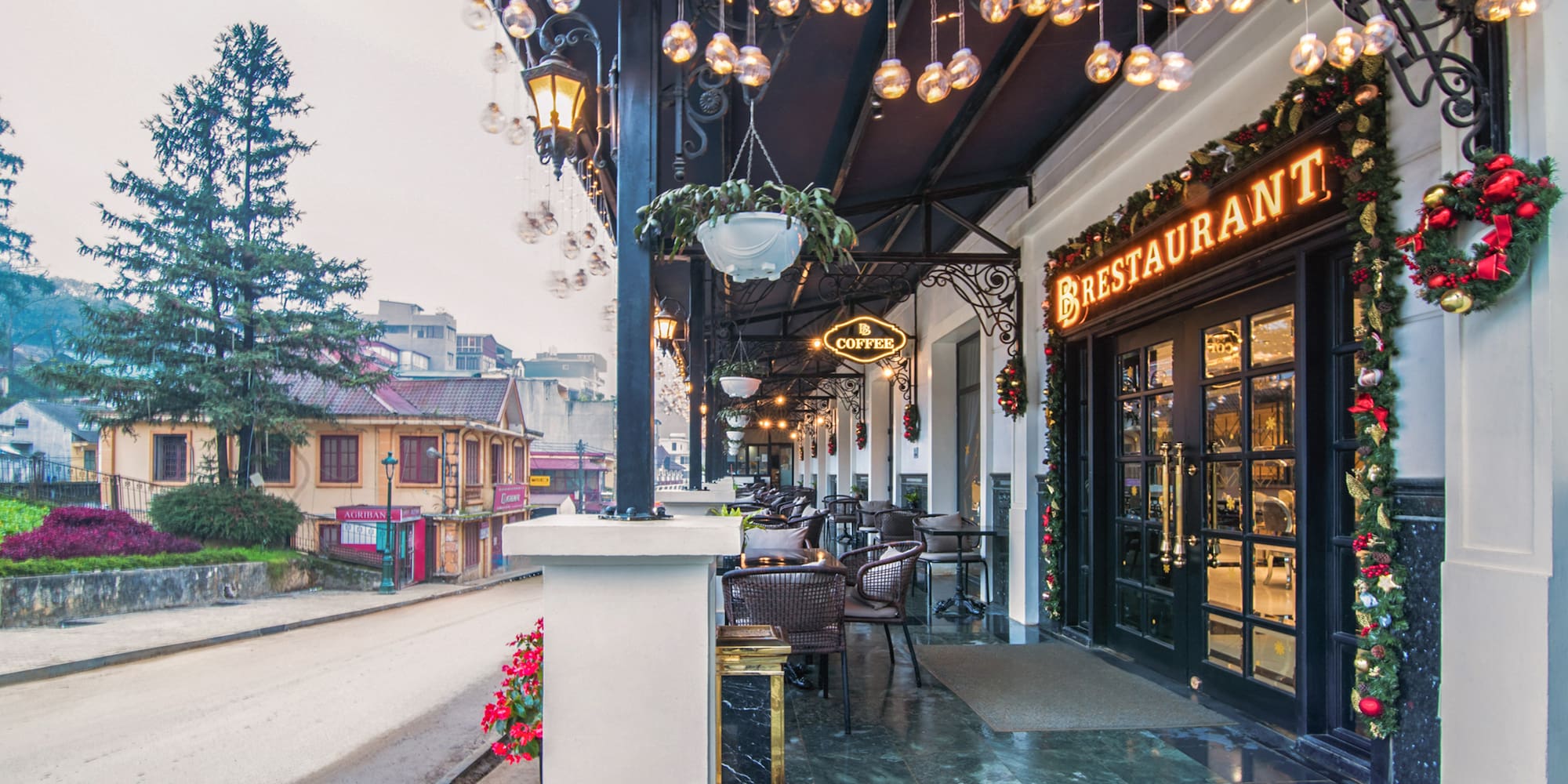 a restaurant with lights from the ceiling