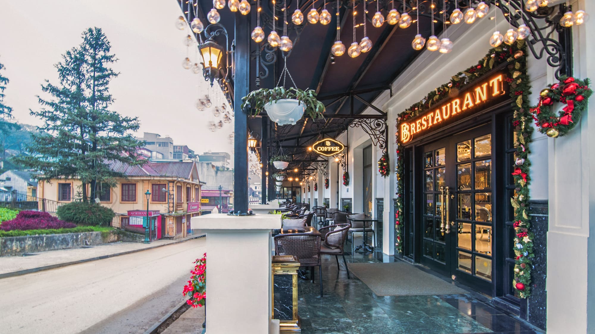 a restaurant with lights from the ceiling