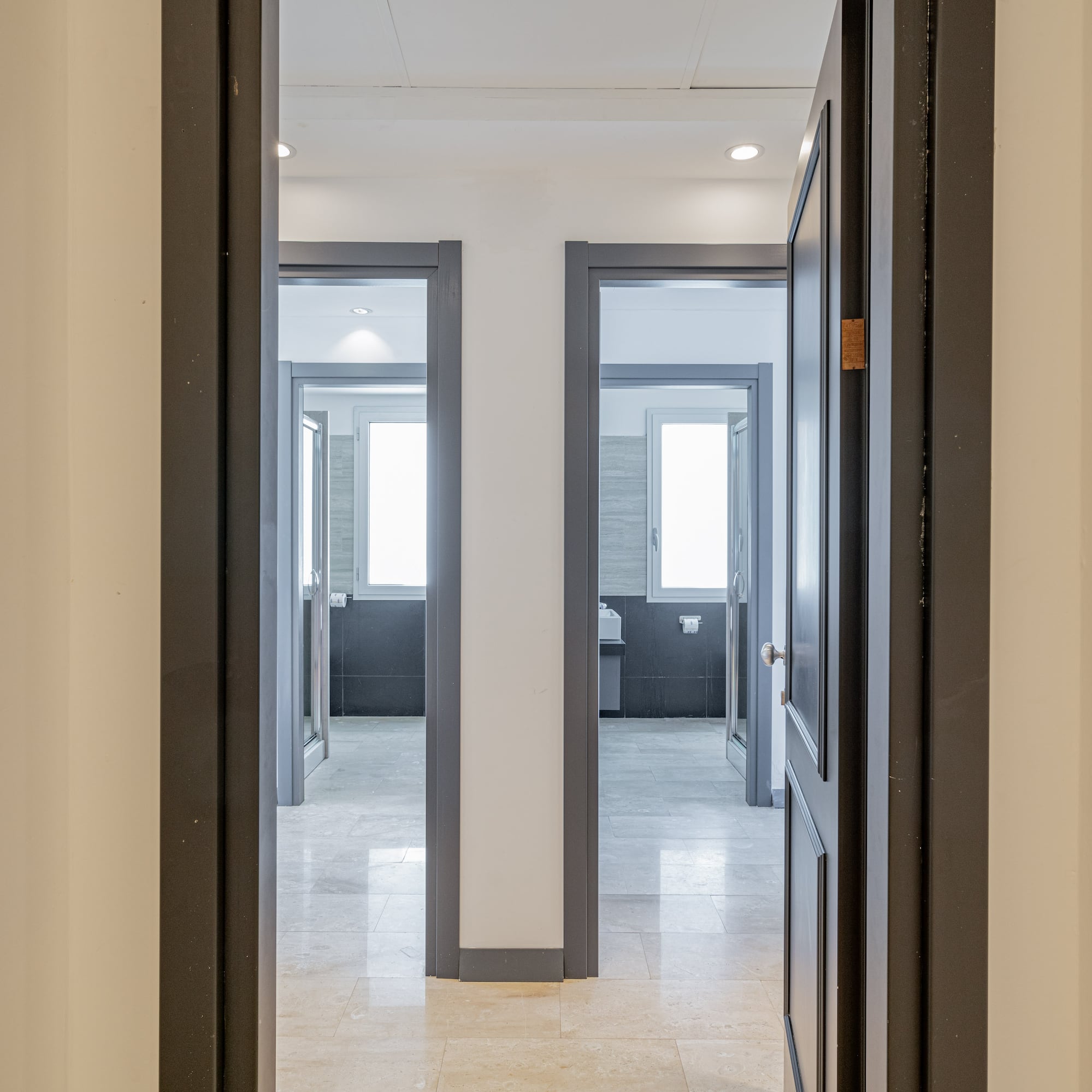 a hallway with two doors