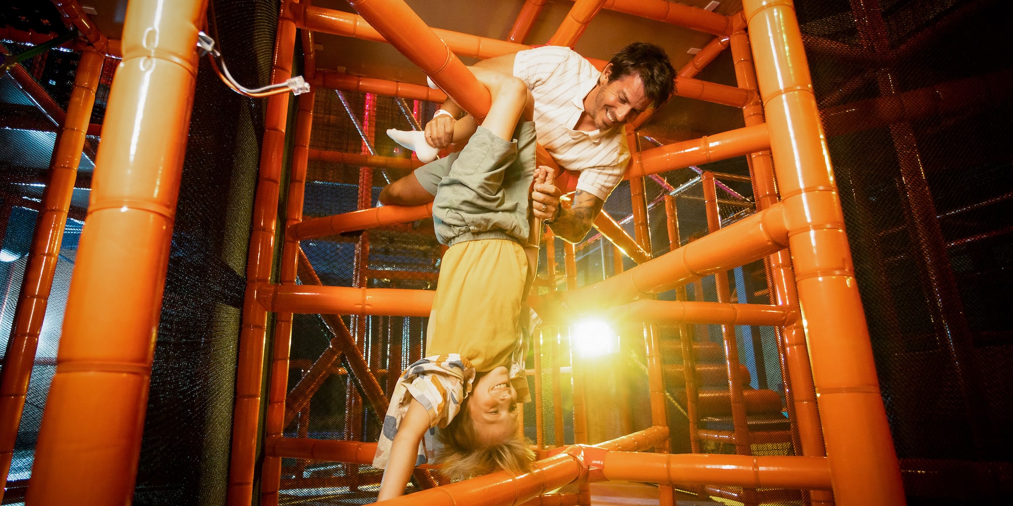 a man and child in a play area