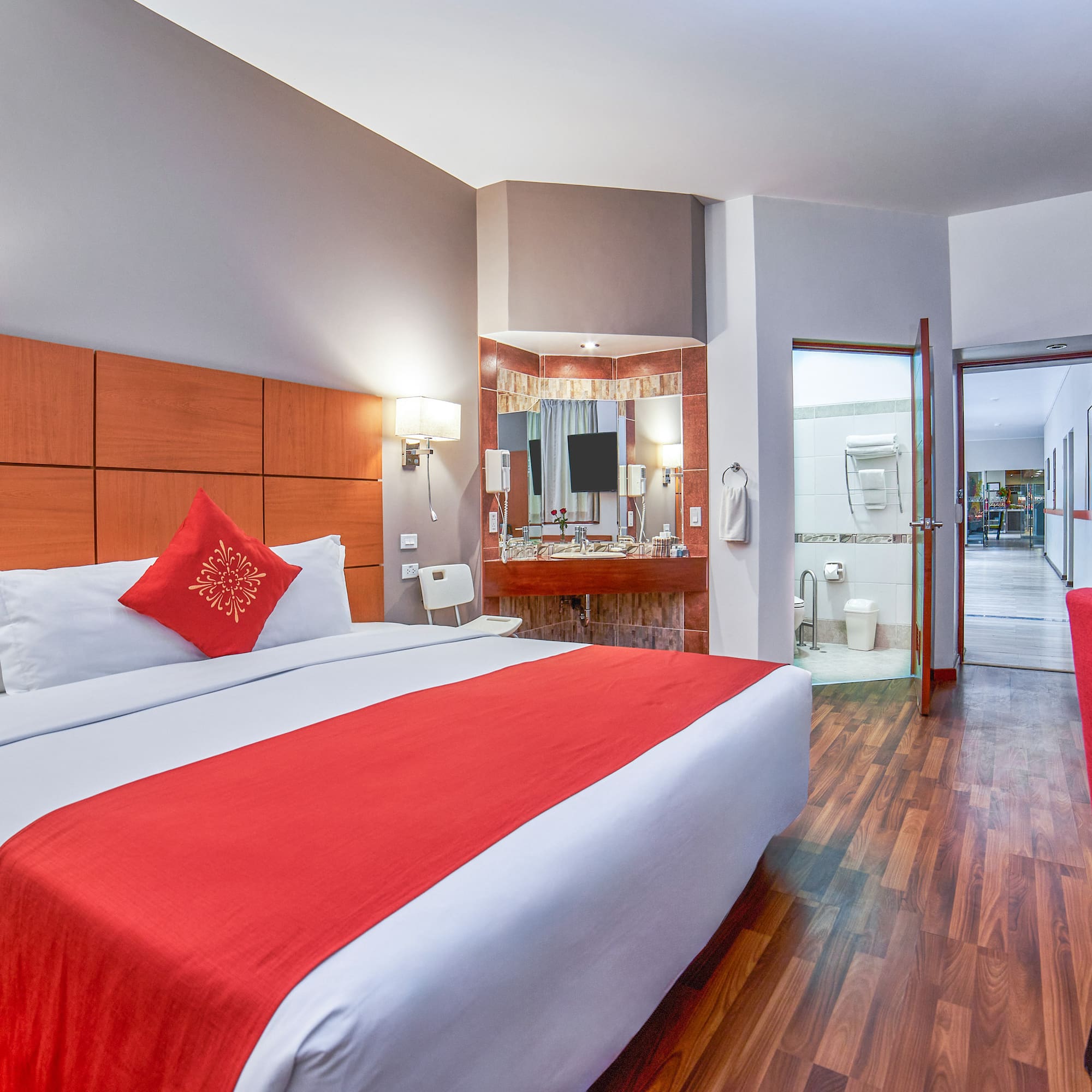 a room with a bed and a mirror