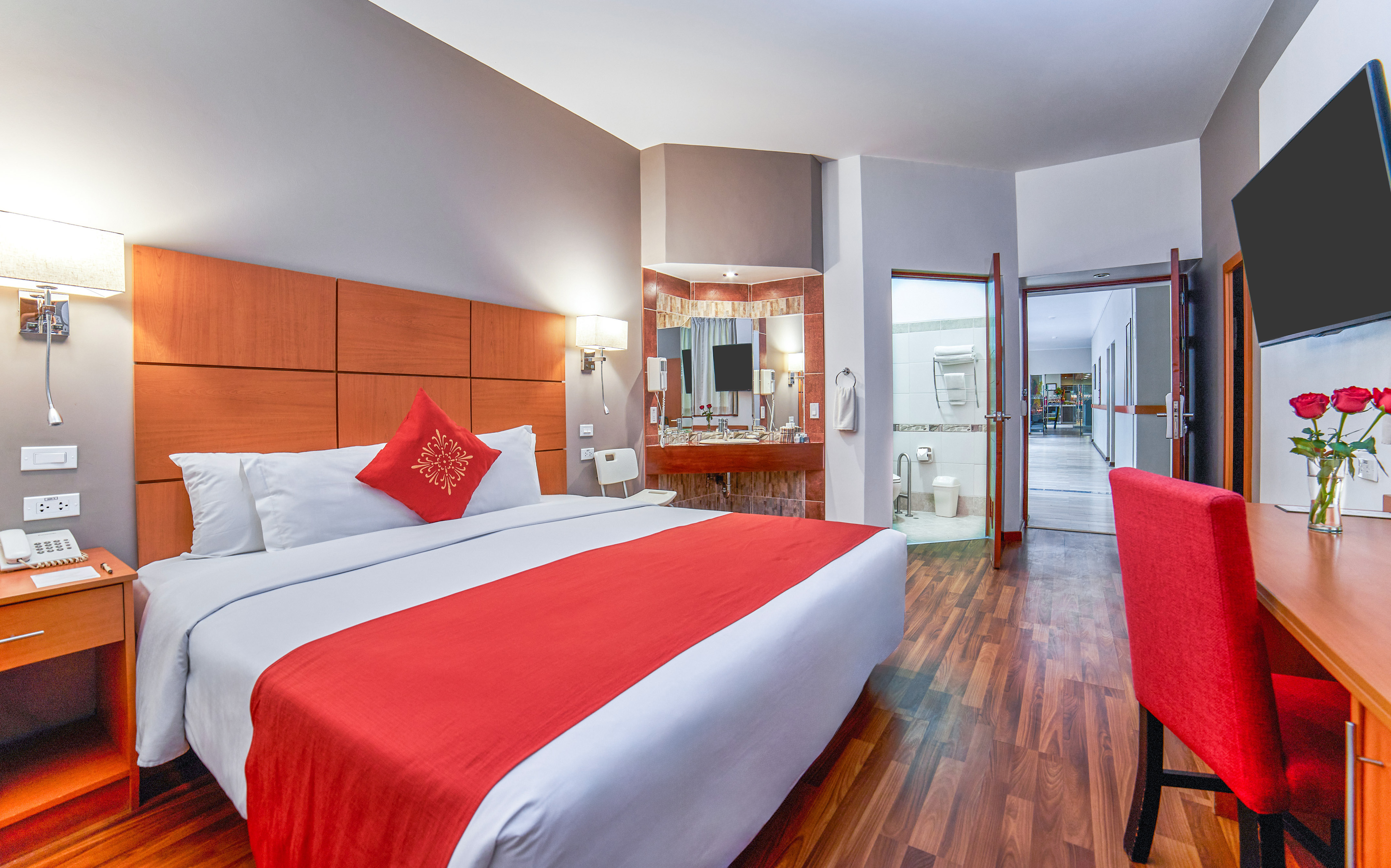 a room with a bed and a mirror