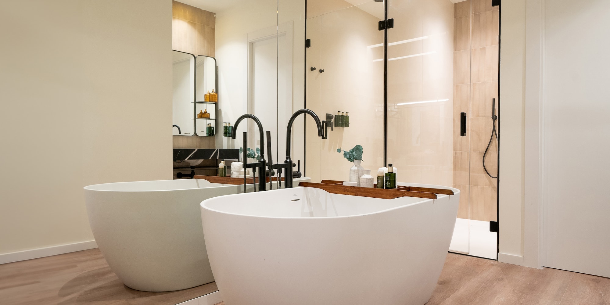 a bathroom with a tub and shower