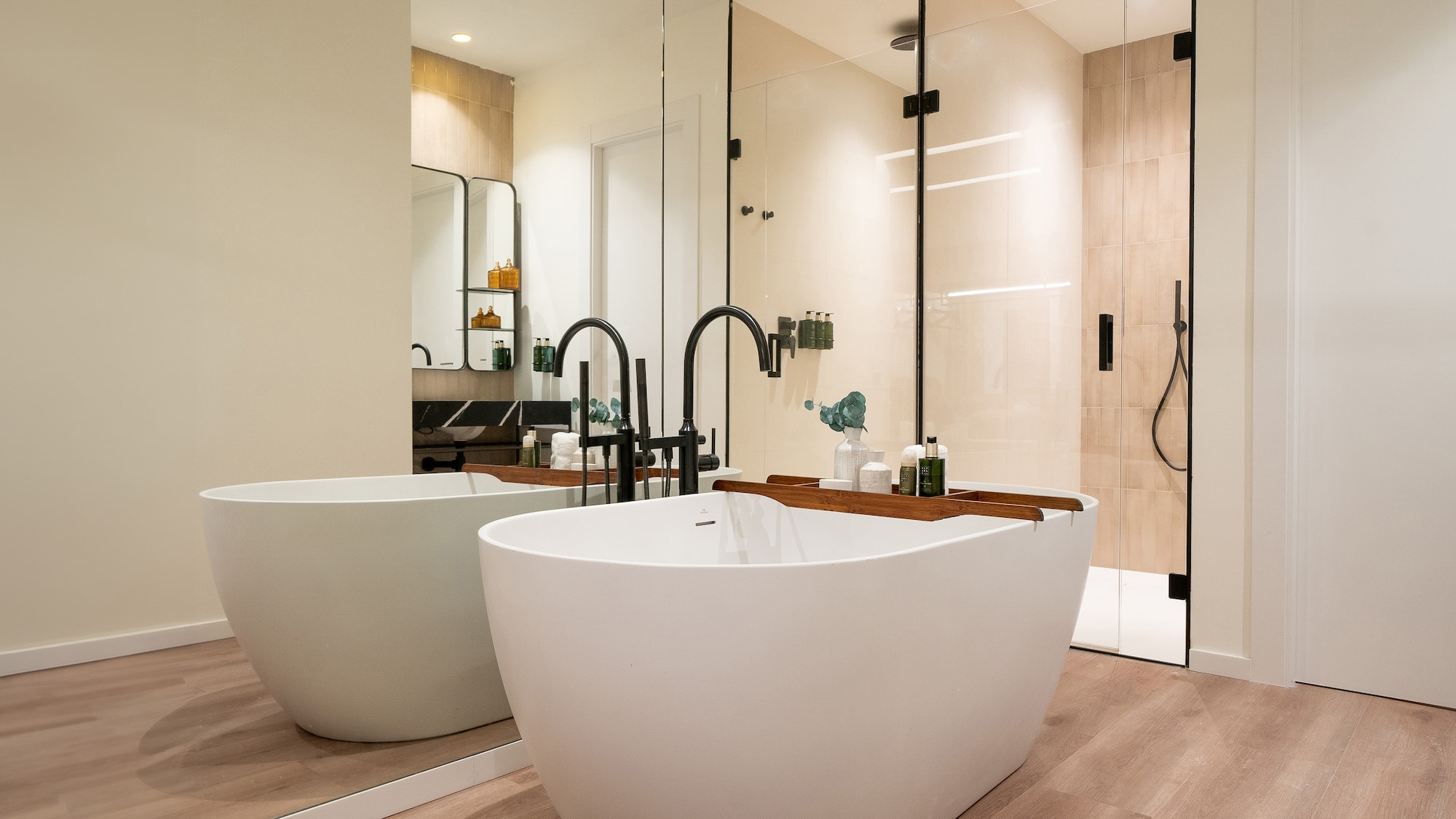 a bathroom with a tub and shower