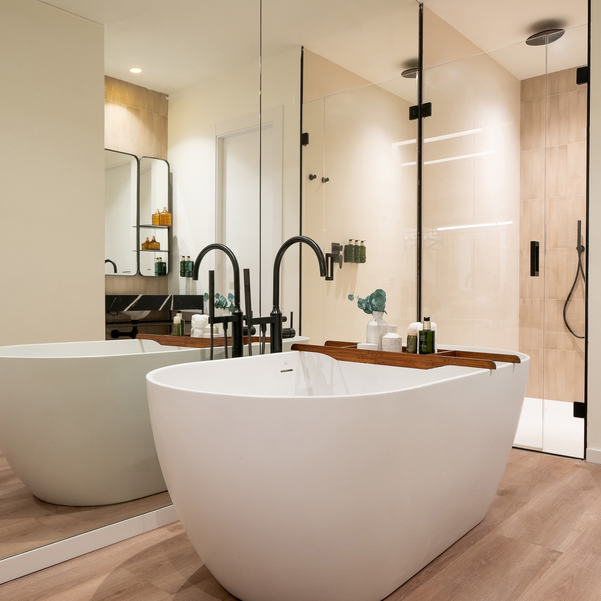 a bathroom with a tub and shower