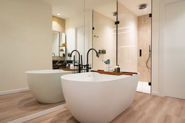 a bathroom with a tub and shower