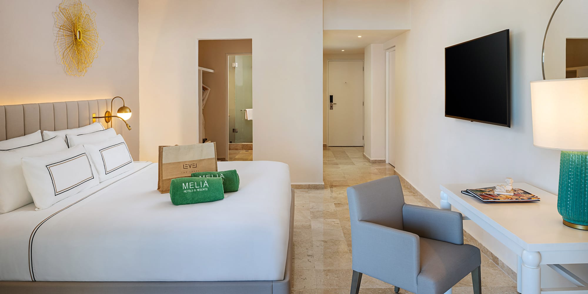 a room with a bed and a television