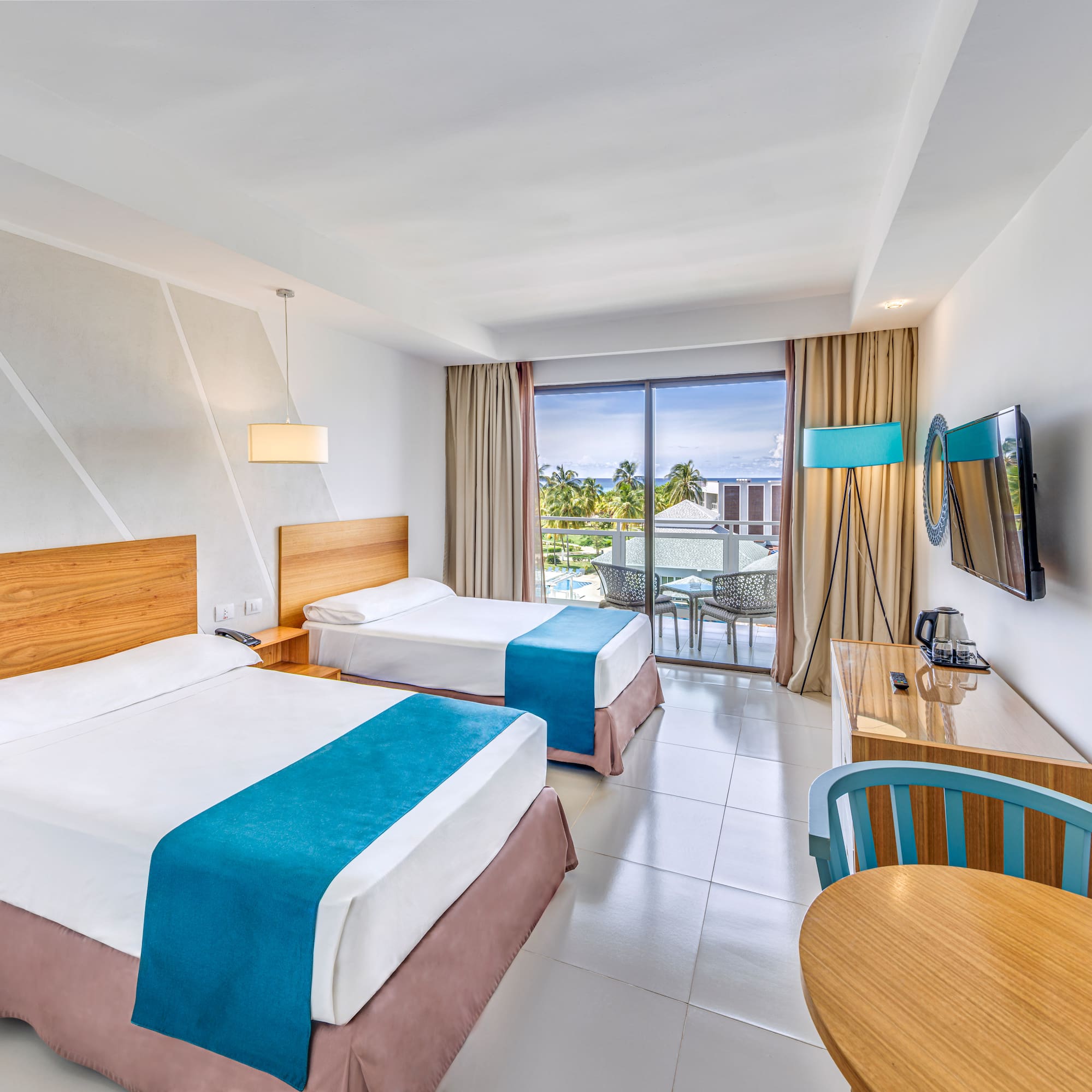 a room with two beds and a table