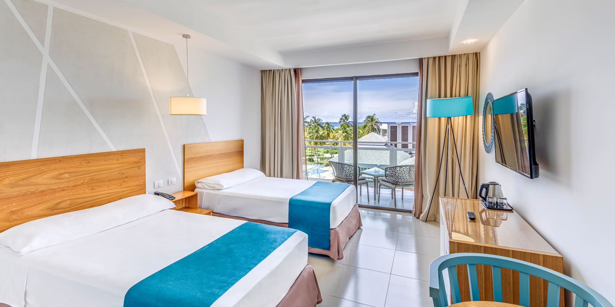 a room with two beds and a table