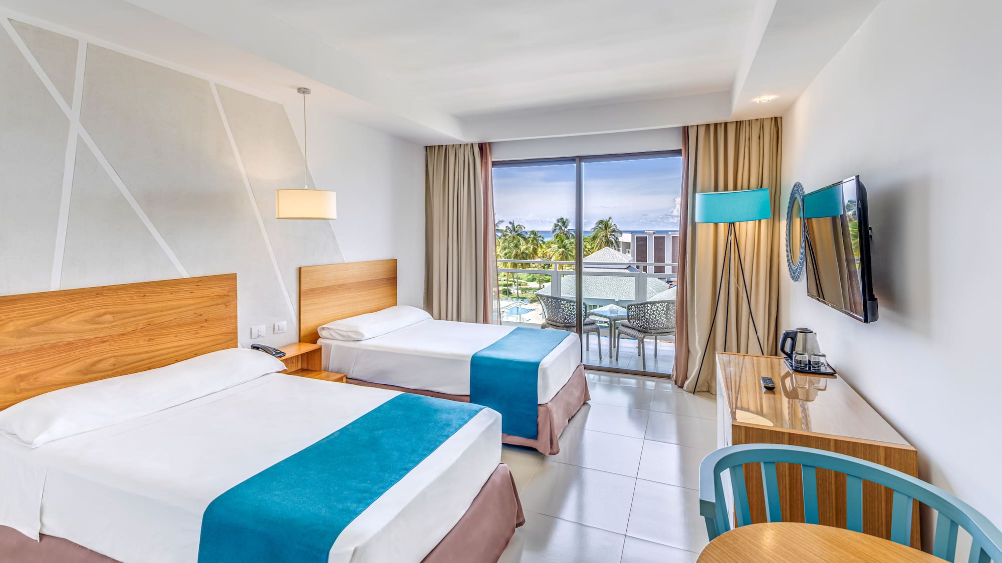 a room with two beds and a table