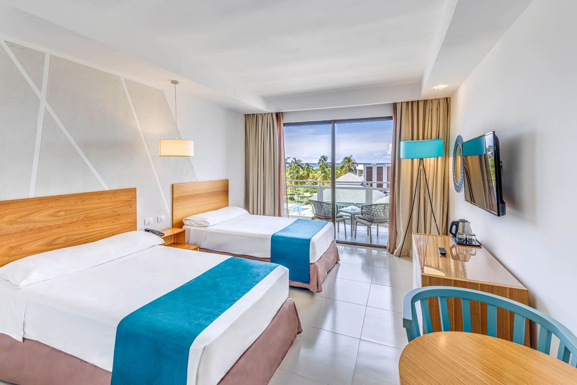 a room with two beds and a table