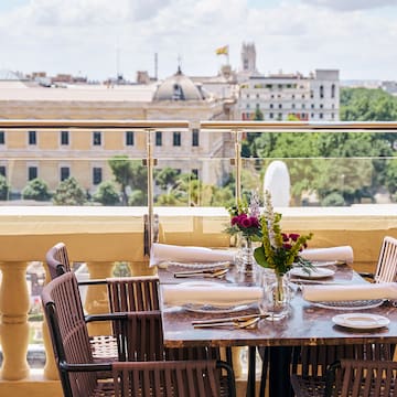 a table set up on a balcony