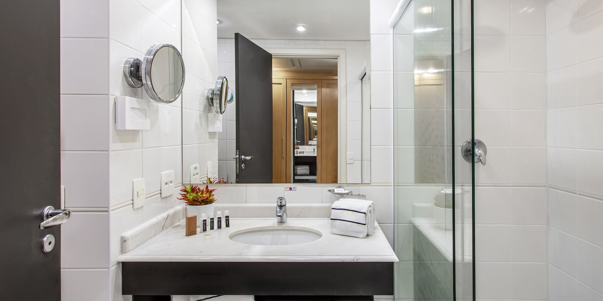 a bathroom with a mirror and sink