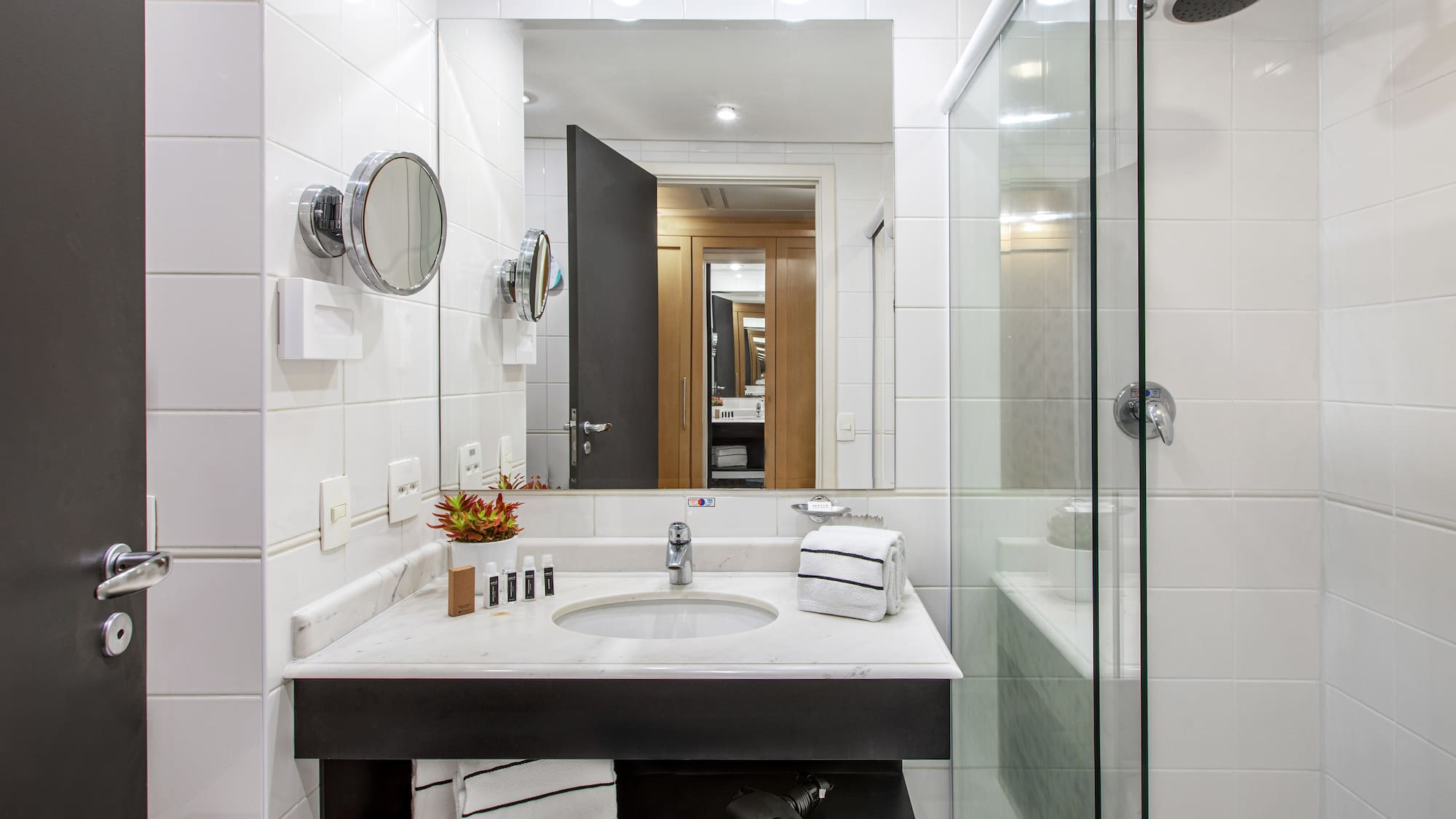 a bathroom with a mirror and sink