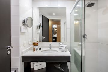 a bathroom with a mirror and sink