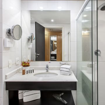 a bathroom with a mirror and sink