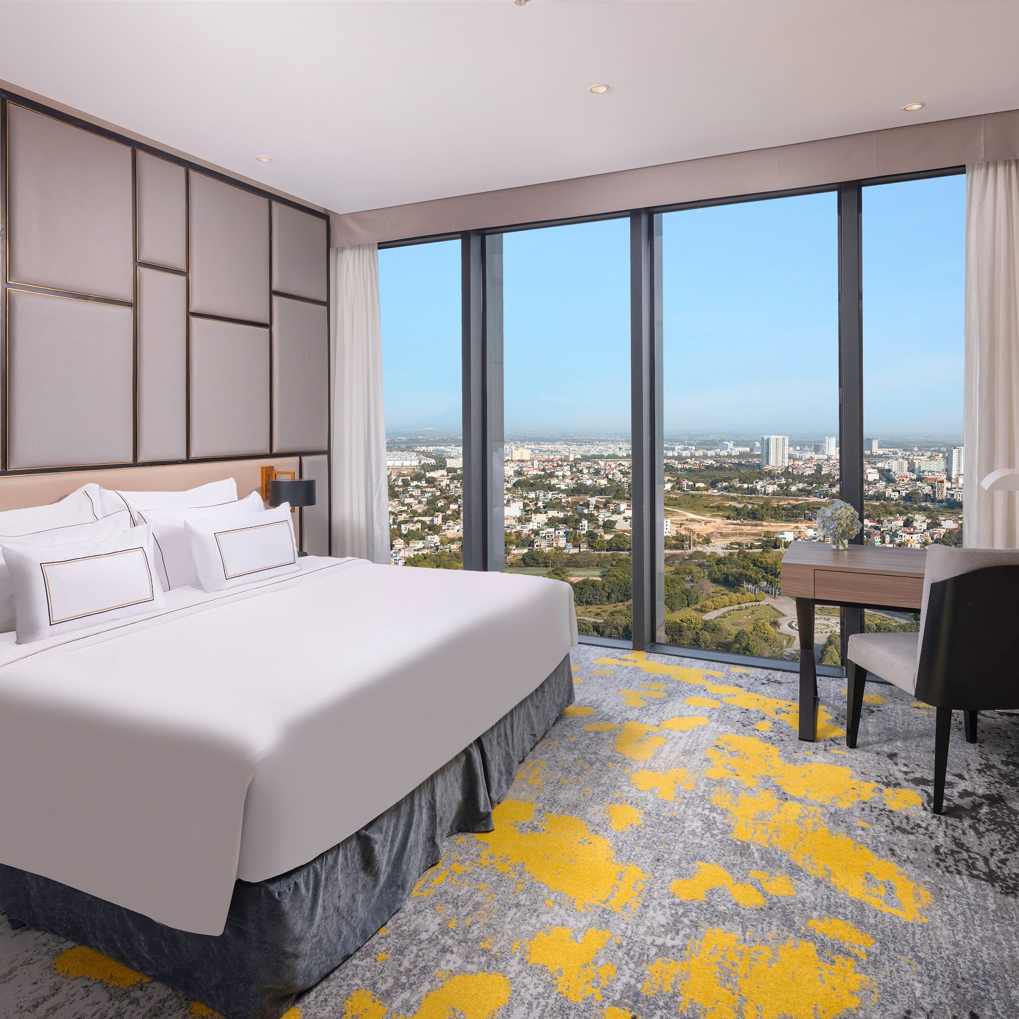 a room with a bed and a desk and a chair