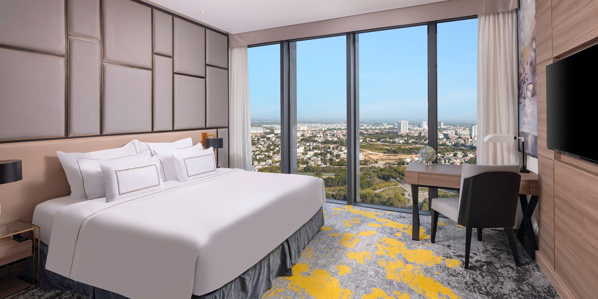 a room with a bed and a desk and a chair