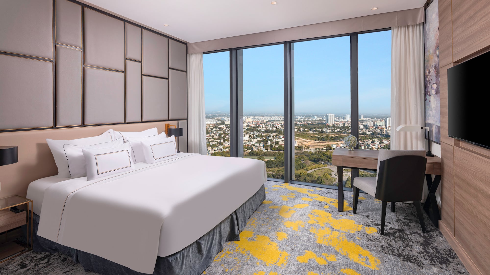 a room with a bed and a desk and a chair