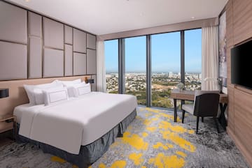 a room with a bed and a desk and a chair