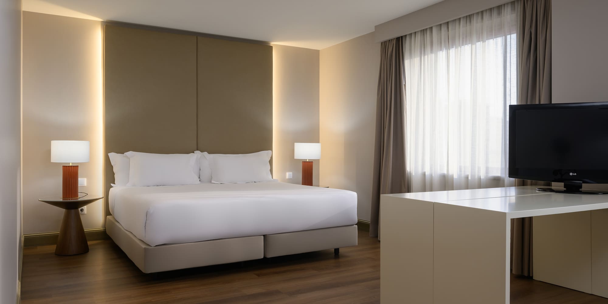 a bedroom with a bed and a table