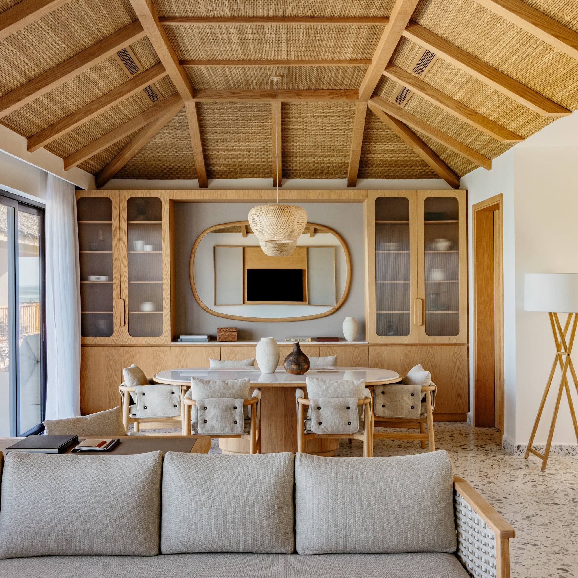 a living room with a table and chairs