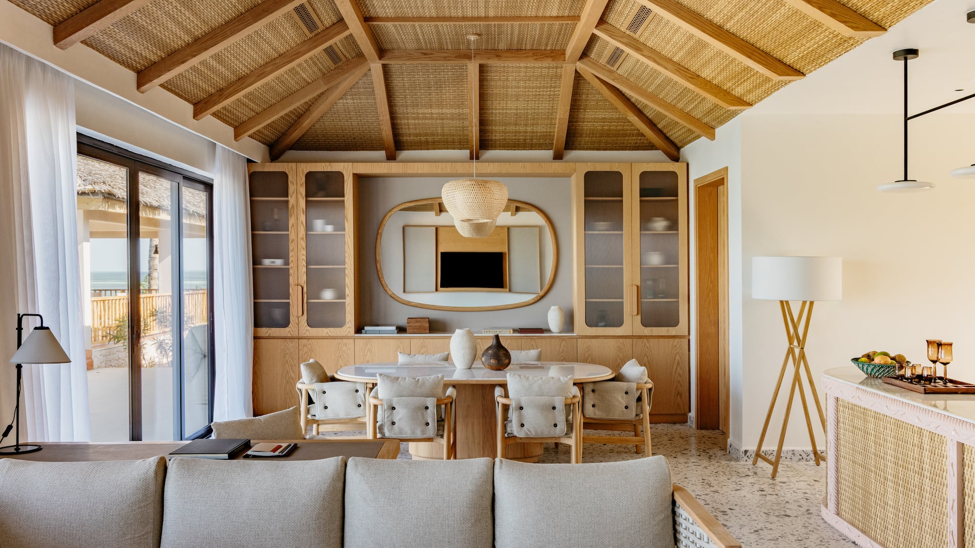 a living room with a table and chairs
