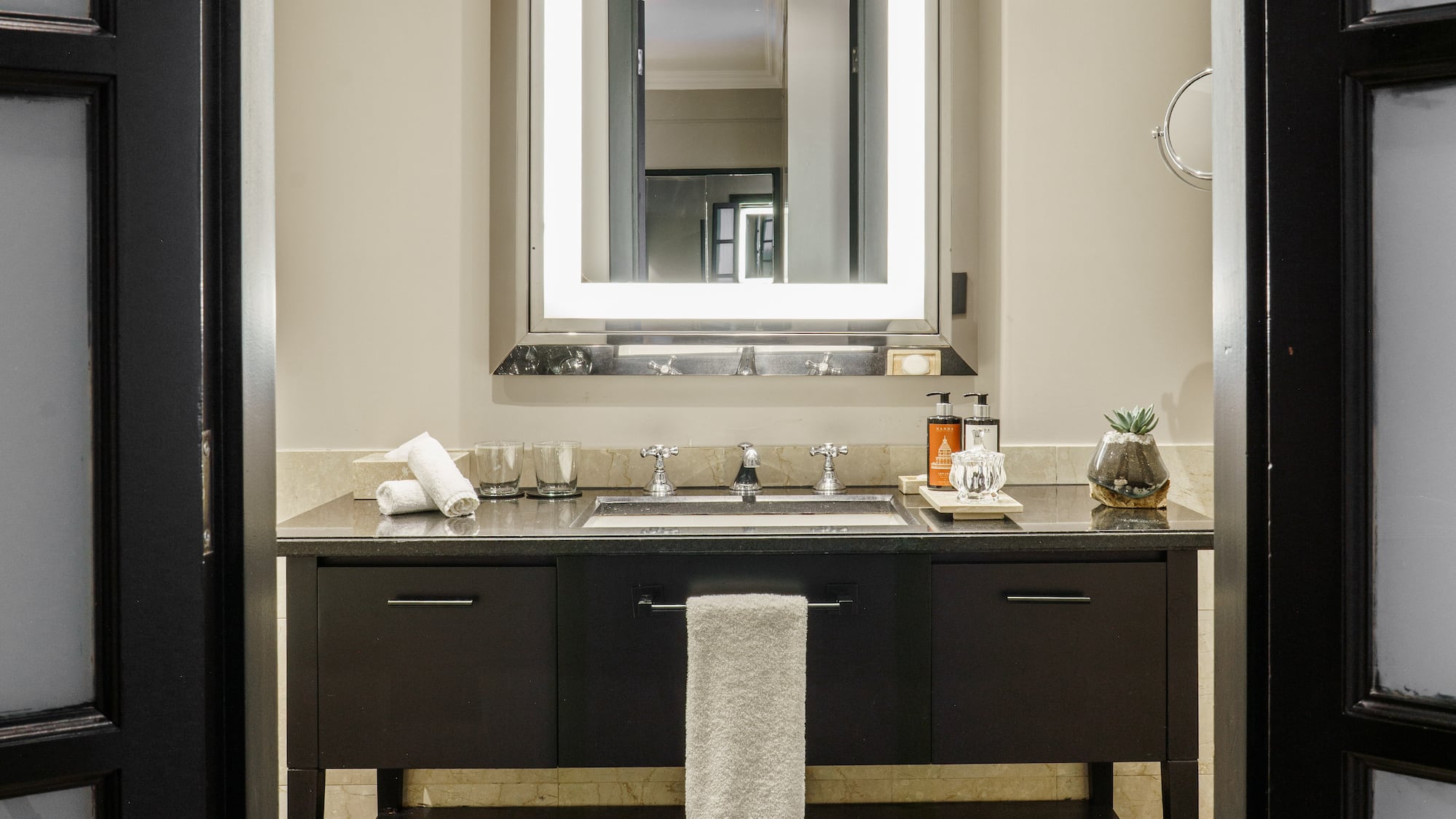 a bathroom with a mirror and sink