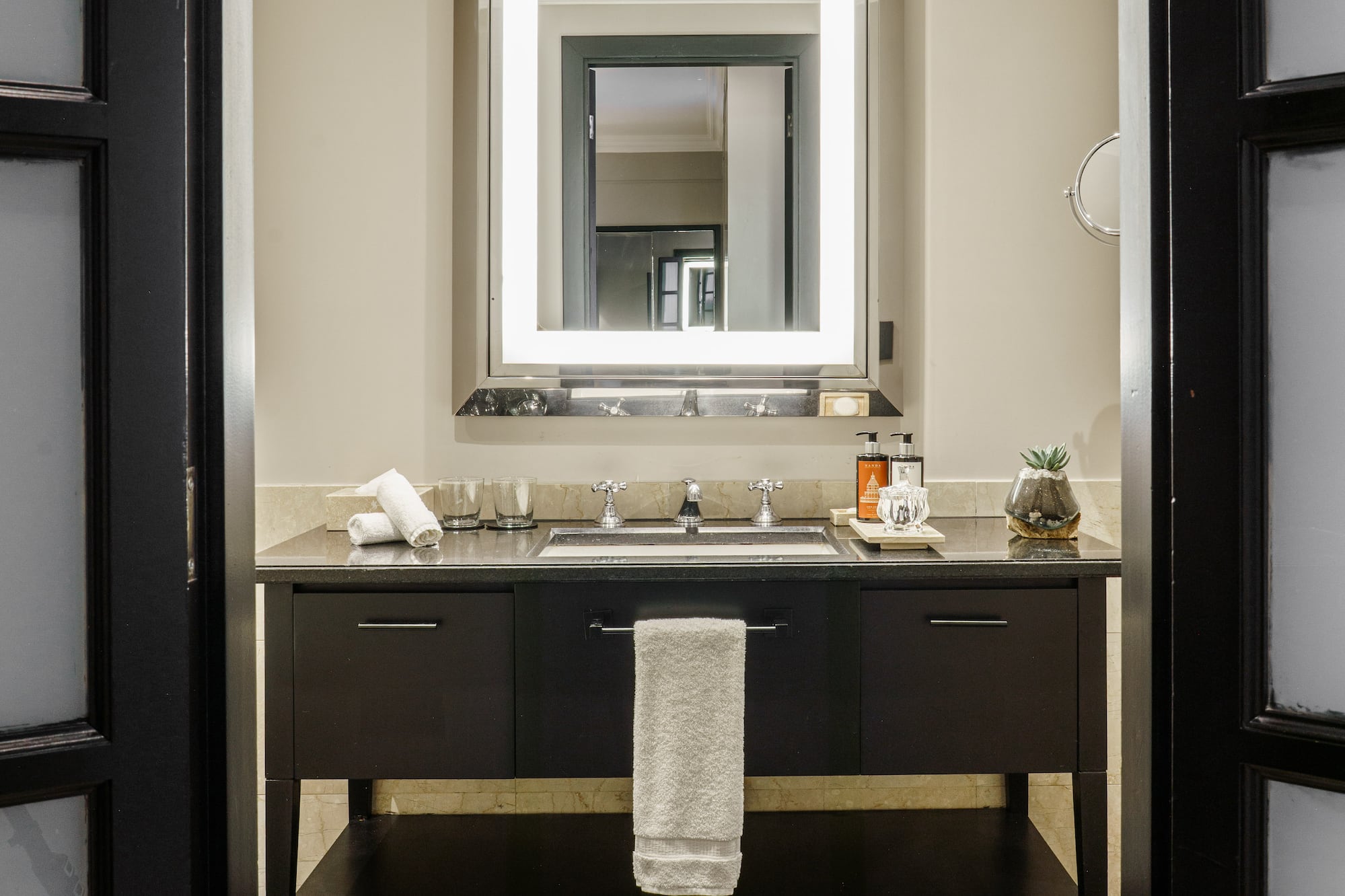 a bathroom with a mirror and sink