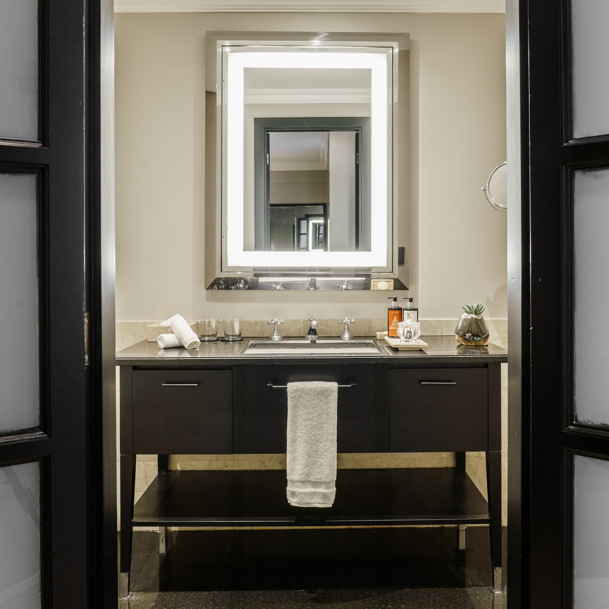 a bathroom with a mirror and sink