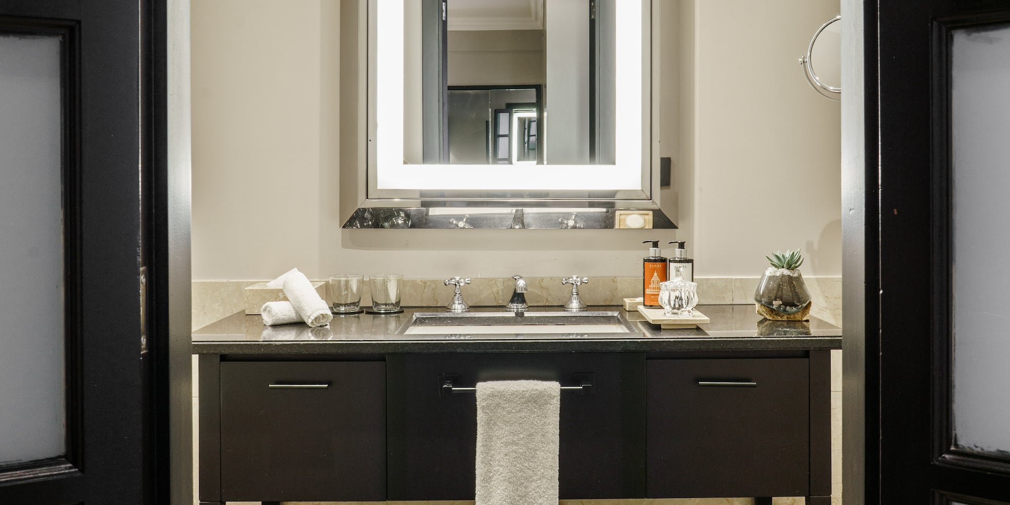 a bathroom with a mirror and sink