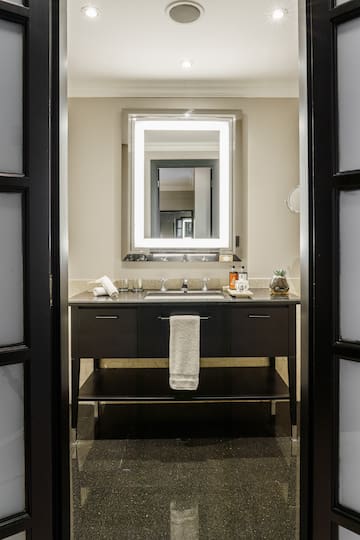 a bathroom with a mirror and sink