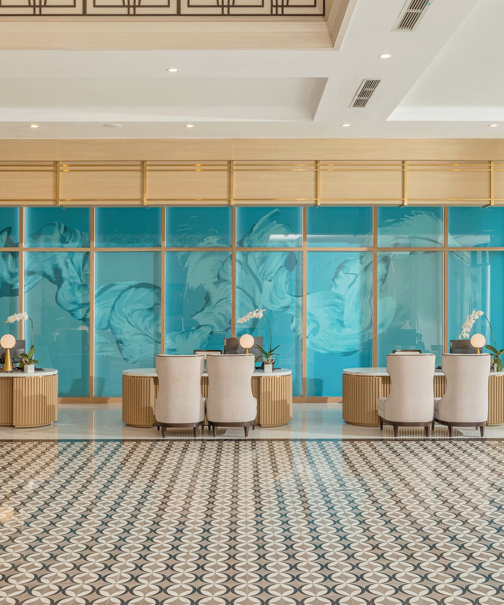 a room with a large glass wall and a large table with chairs