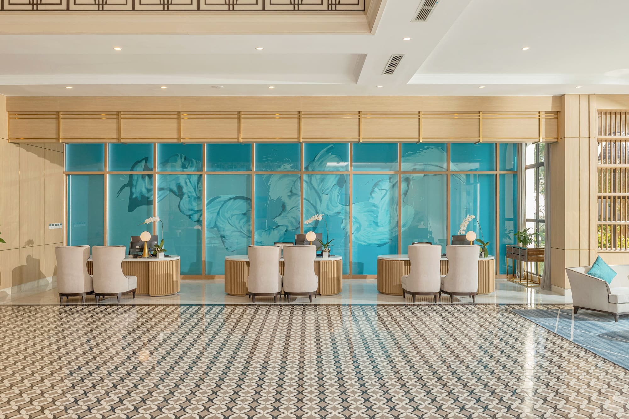 a room with a large glass wall and a large table with chairs