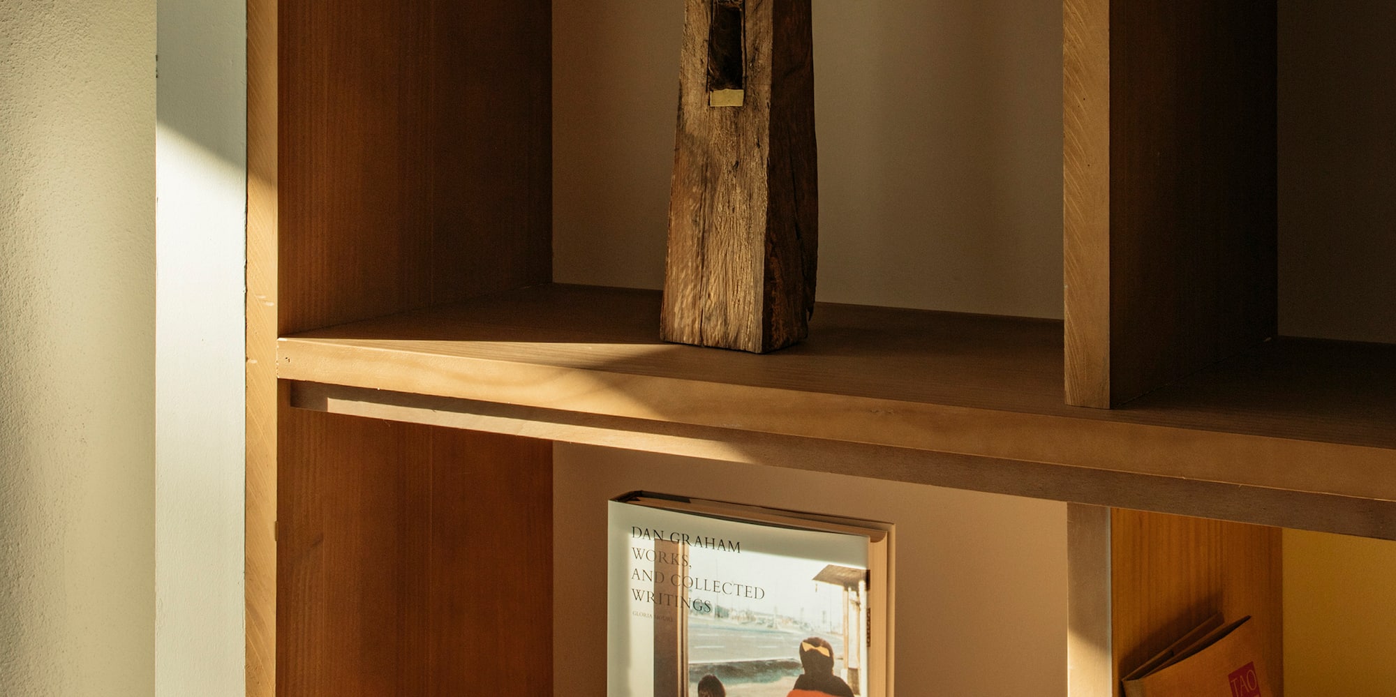 a shelf with a picture and a statue on it