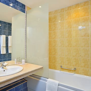 a bathroom with a sink and bathtub