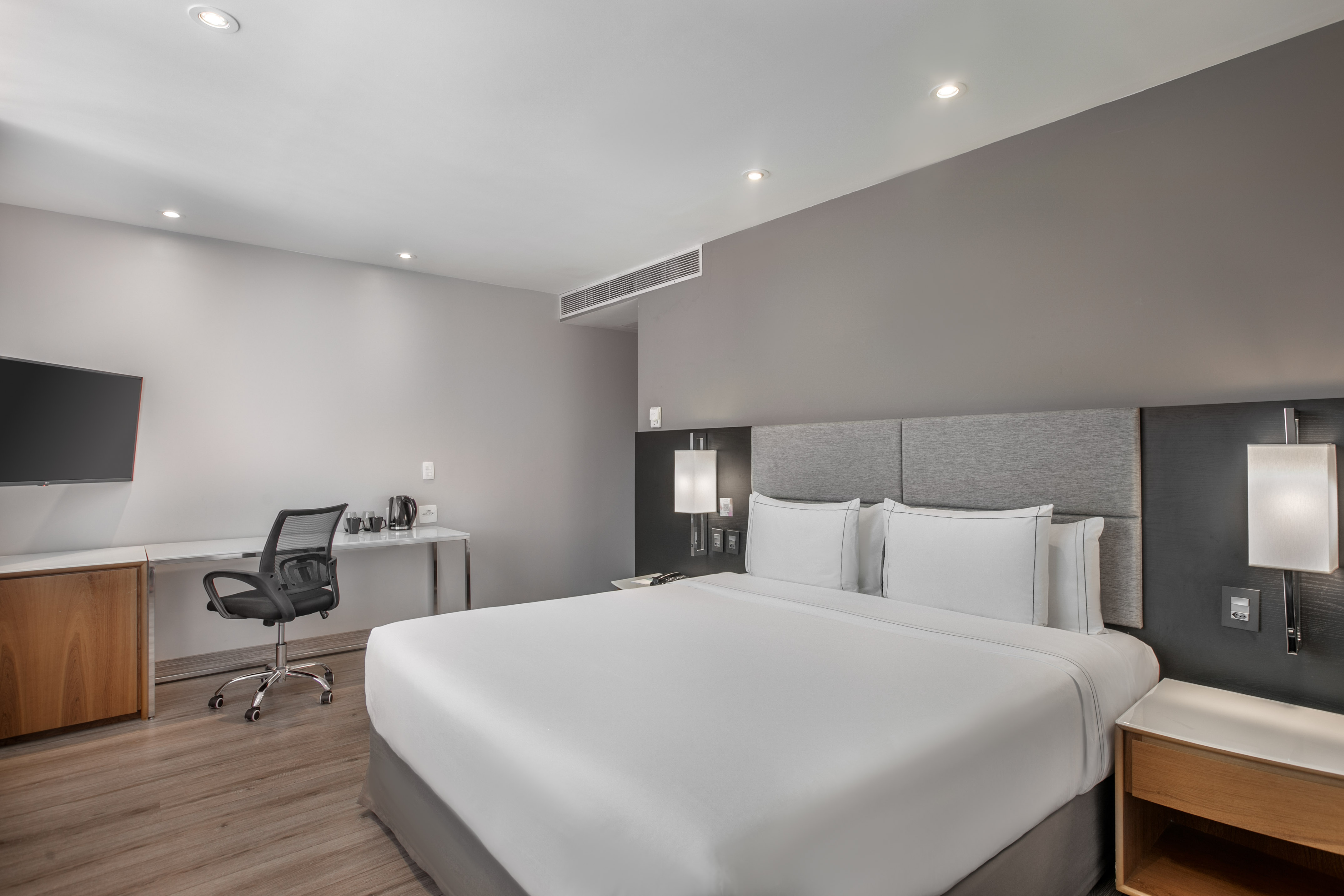 a room with a bed and a desk