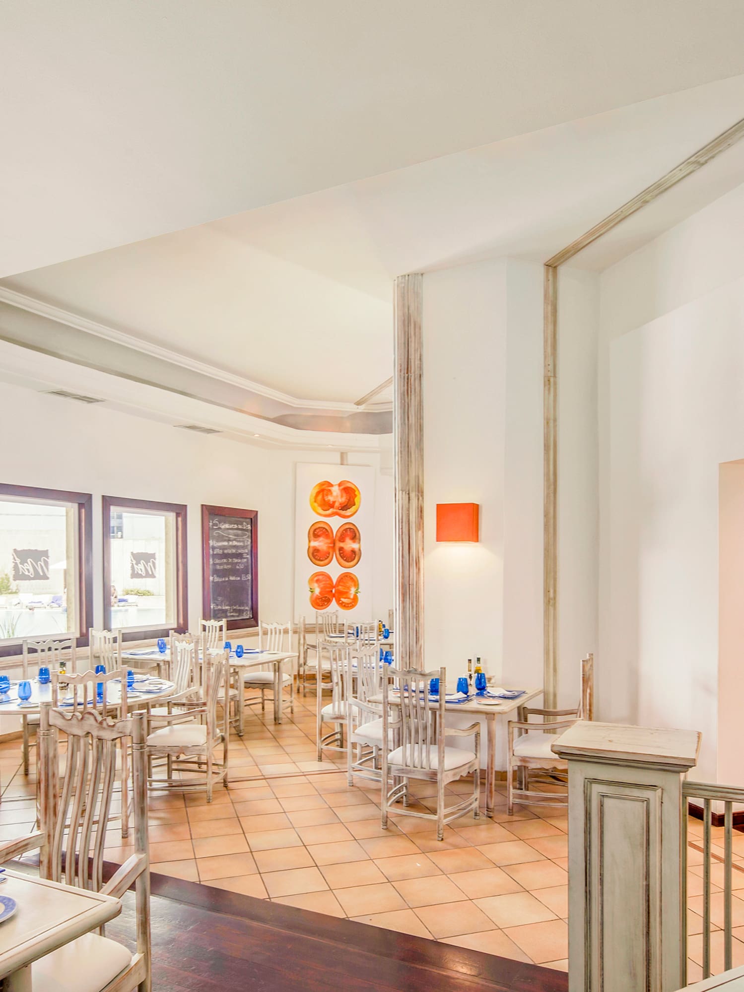 a room with tables and chairs