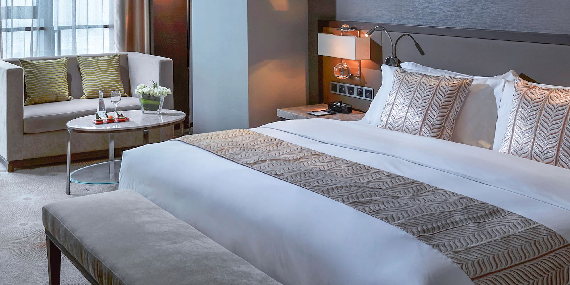 a hotel room with a bed and a table