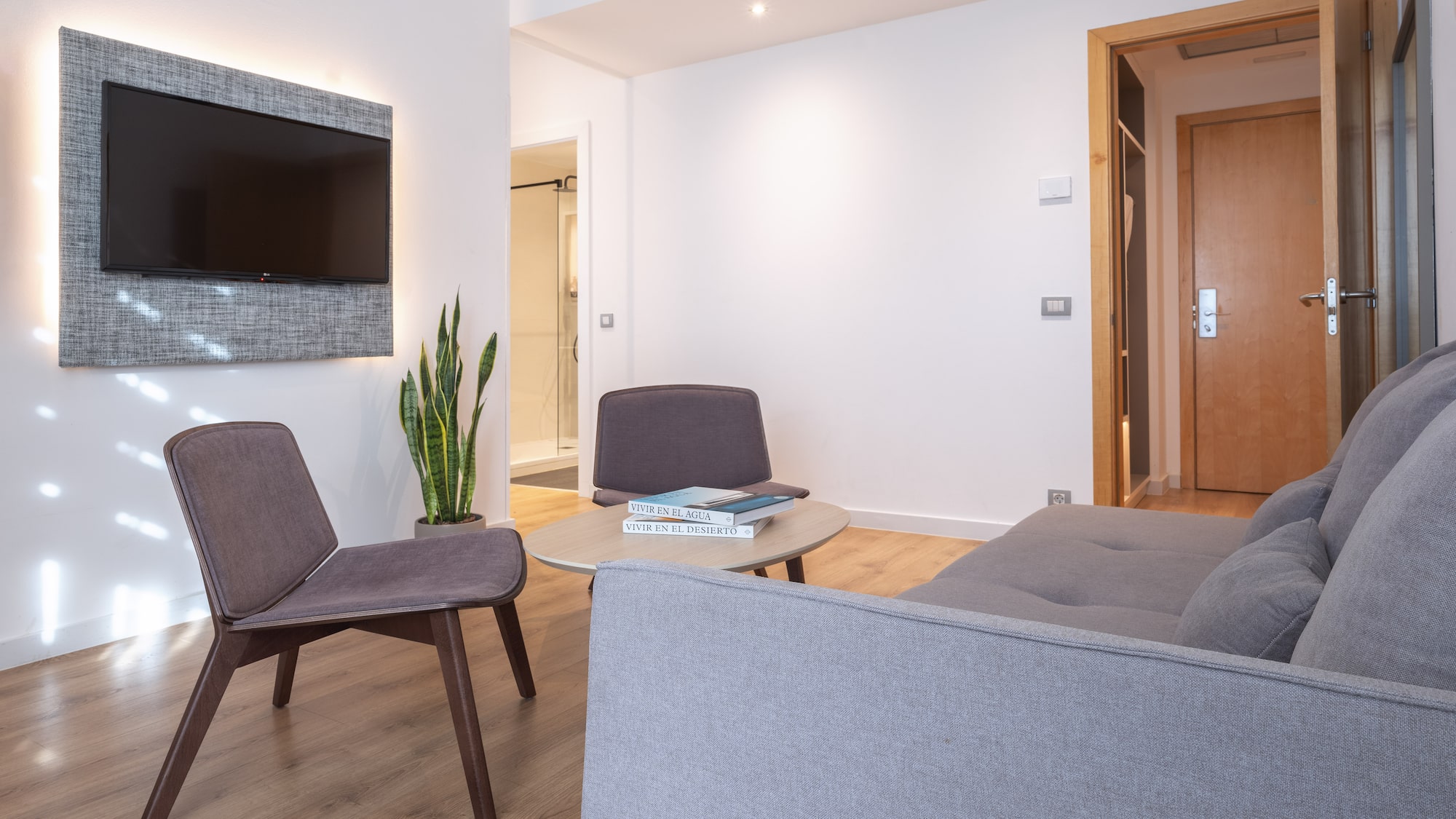 a living room with a tv and a couch