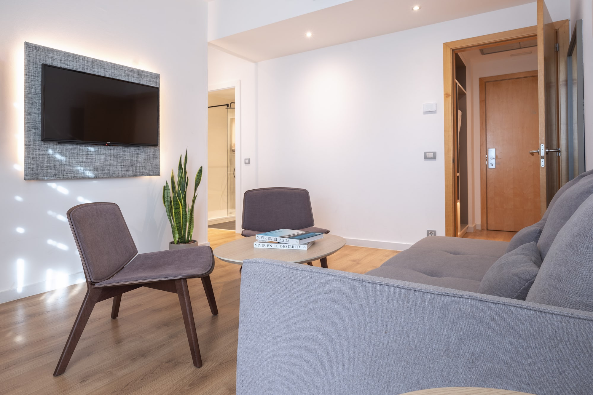 a living room with a tv and a couch