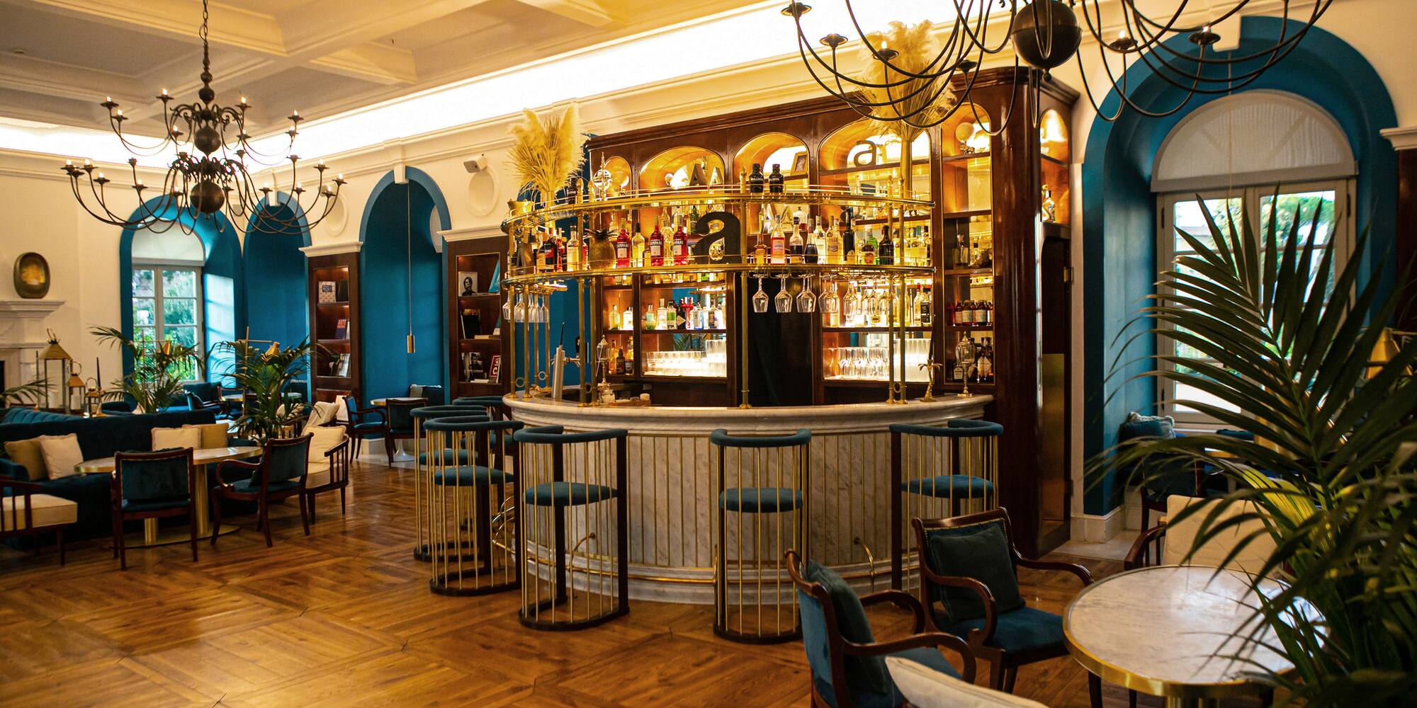 a room with a bar and chairs