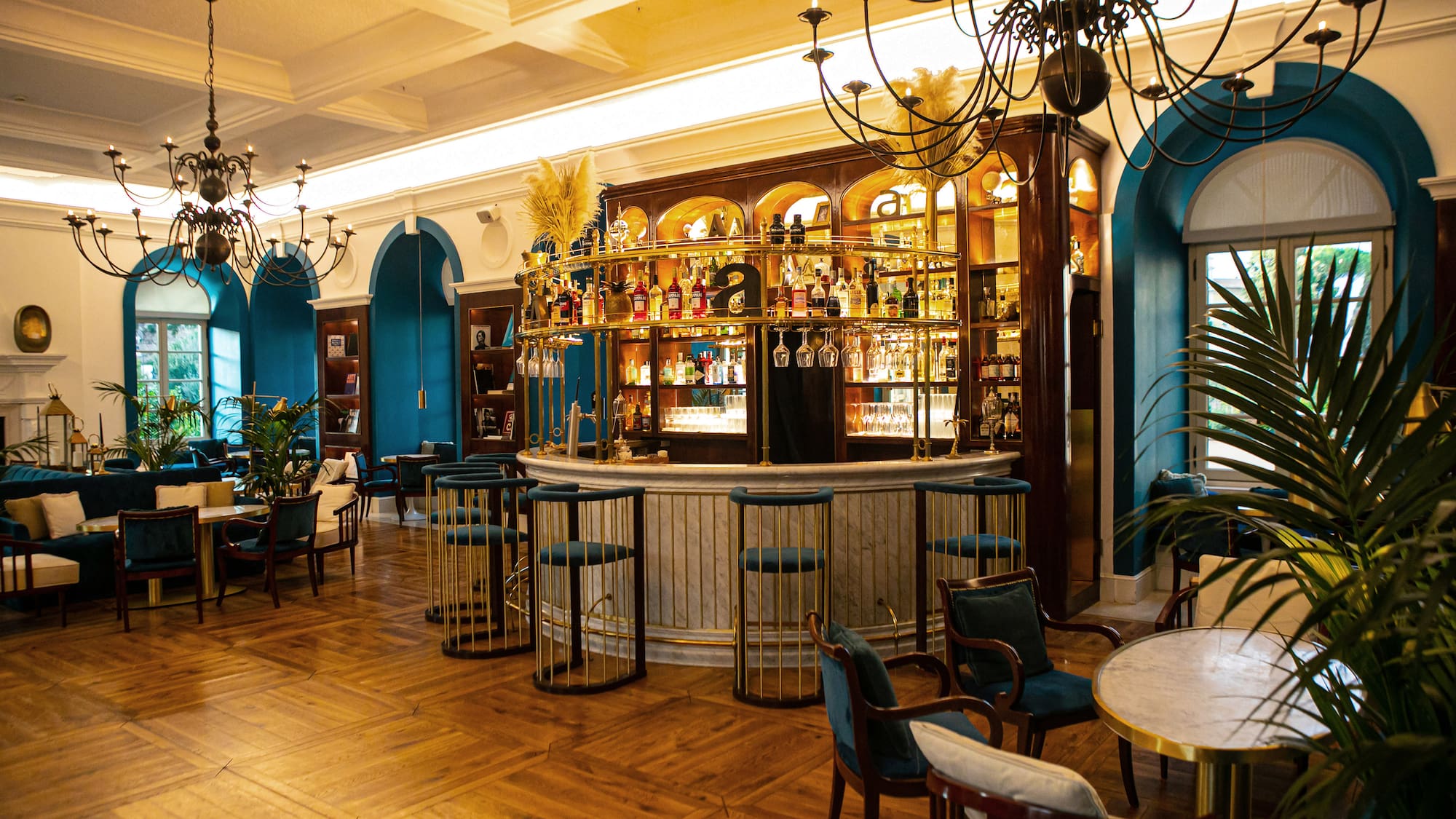 a room with a bar and chairs