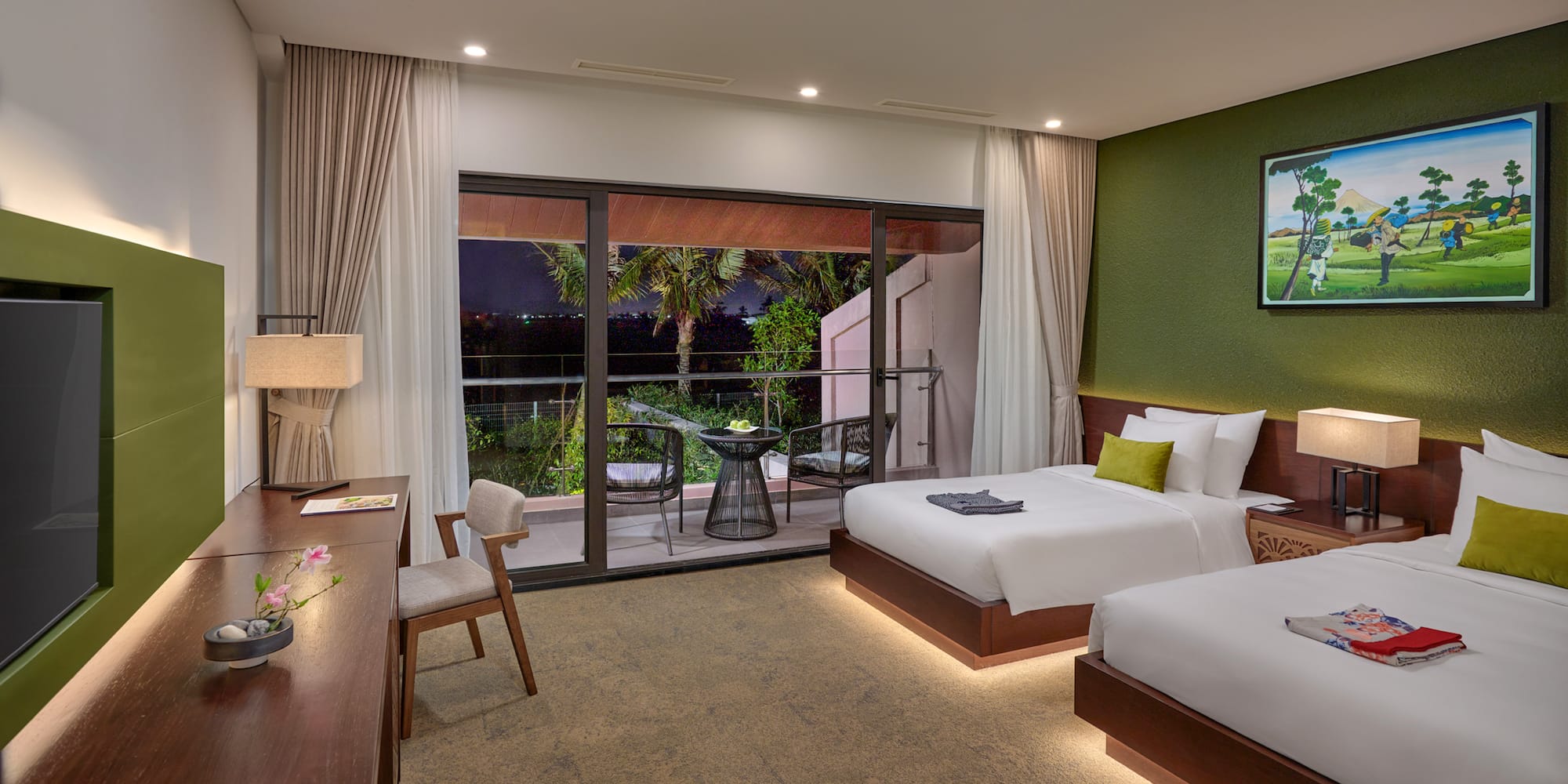 a room with two beds and a table