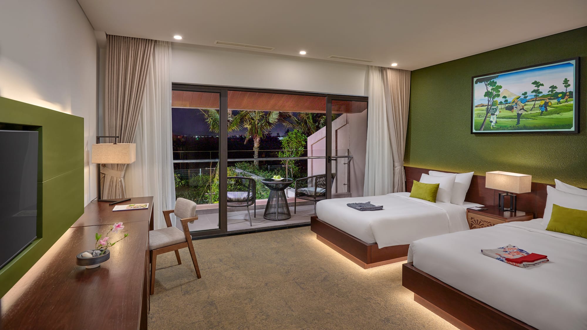 a room with two beds and a table