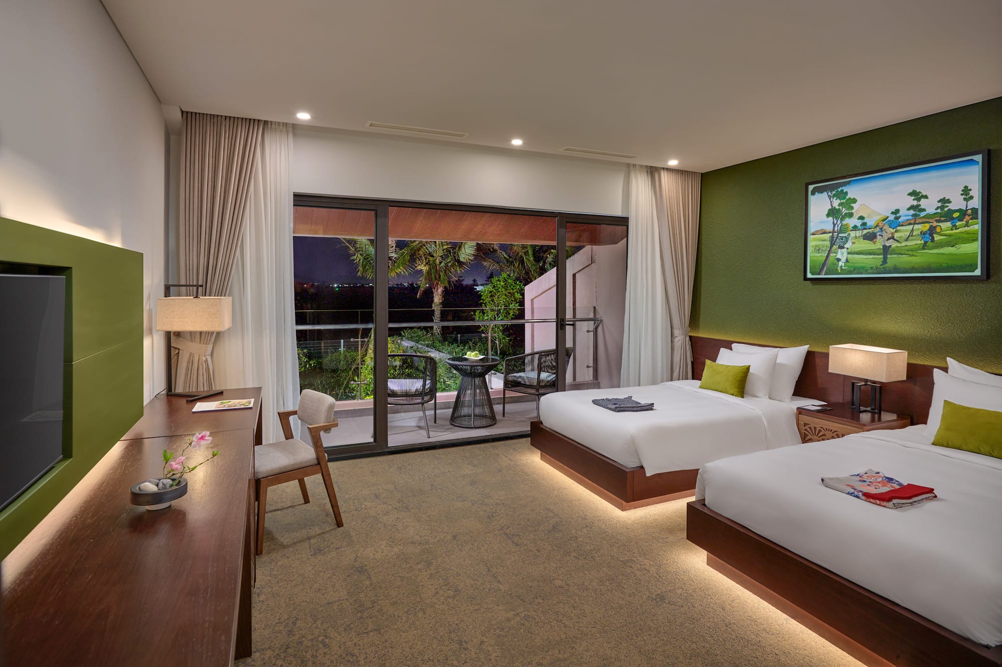 a room with two beds and a table